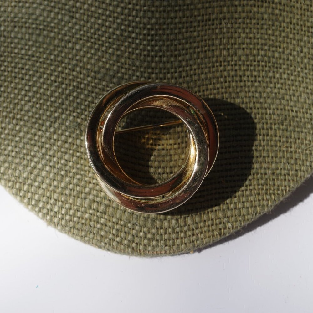 Women`s gold tone brooch pin. 1 3/8 inches wide. S